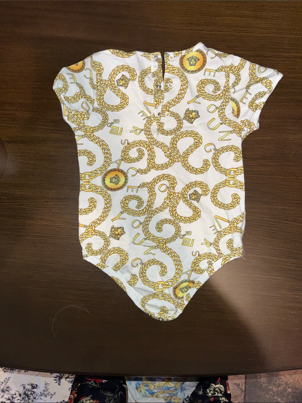 Versace White Onesie with Gold Chain Print